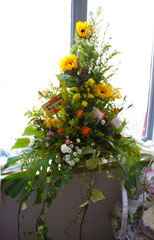 Photo 7  - Flower Festival Display 3 - Tea Trolley and Window - sponsored and arranged by Pop In - Window by Ash Green